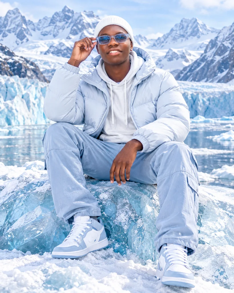 Luxury winter adventure portrait on an icy mountain glacier